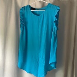 Blue shirt your able to knot the bottom